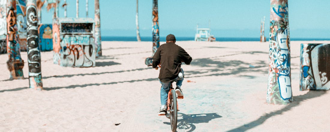 Man cycling in Miami by Dominick Davis