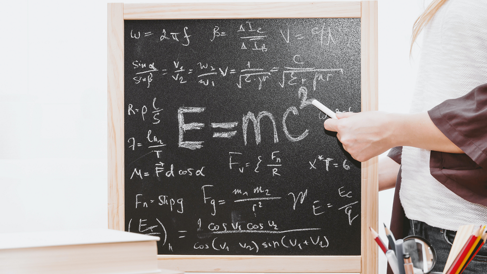 Equation written on chalkboard by JE Shoots from Unsplash. 