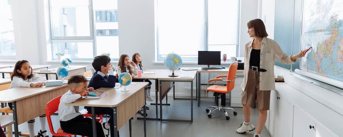 Teacher standing in front of class by Thirdman 