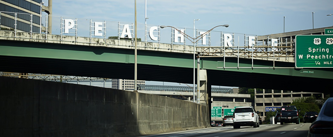 Peachtree sign over the highway in Atlanta by Jacob McGowin