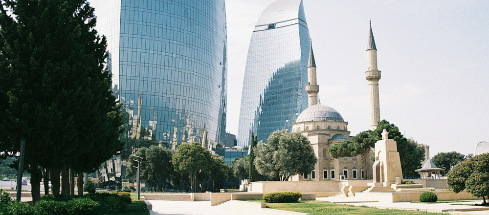 The Alley of Martyrs Mosque and Fairmont Baku Flame Towers by Dario Daniel Silva on Unsplash
