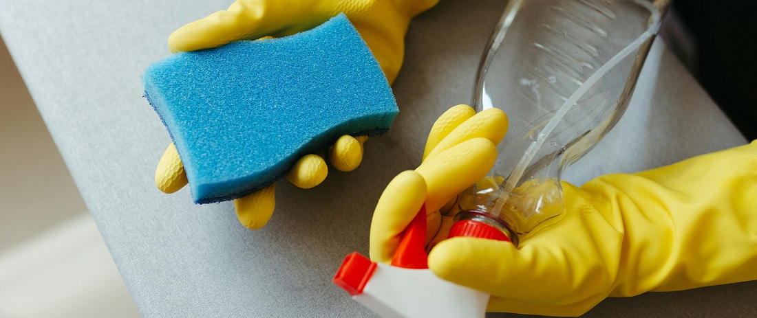 Hands cleaning with a sponge and spray bottle by Jonathan Borba