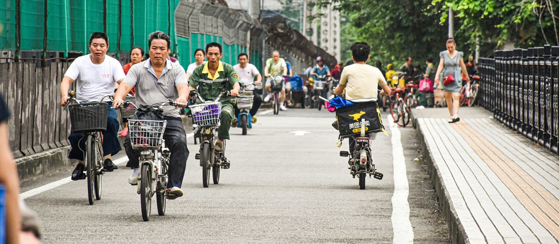 Locals riding bicycles in Guangzhou by Lan Lin