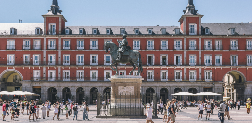 Pedestrians in Plaza Mayor in Madrid by Kristijan Arsov on Unsplash
