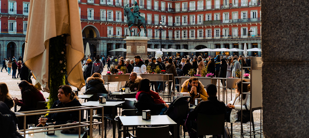 Diners in the Plaza Mayor by Deniz Demirci on Unsplash