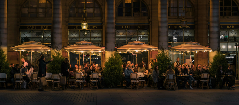 Nighttime Cafegoers in Paris by Siyuan on Unsplash