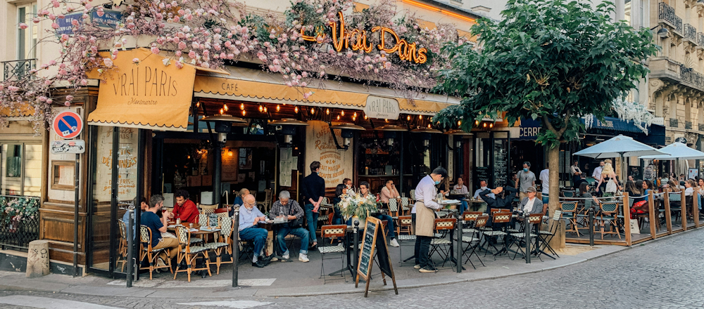 Vrai Paris Café on Paris Street Corner by Alex Harmuth on Unsplash