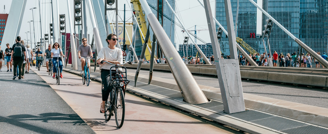 Cyclists on Bridge in Rotterdam by Eryk Piotr Munk