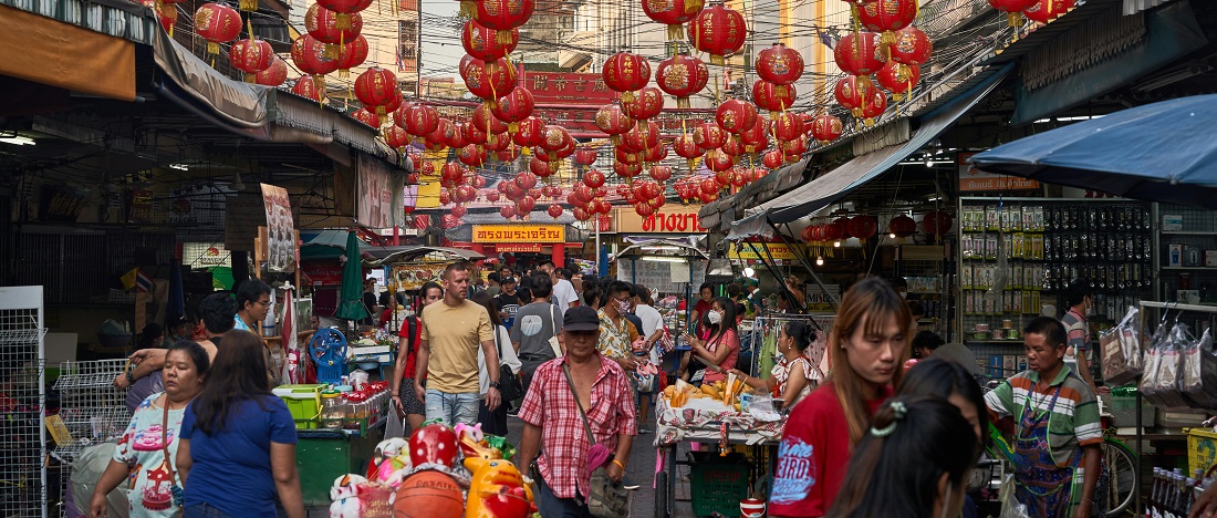 Shopping at a local market in Shanghai by Norbert Braun