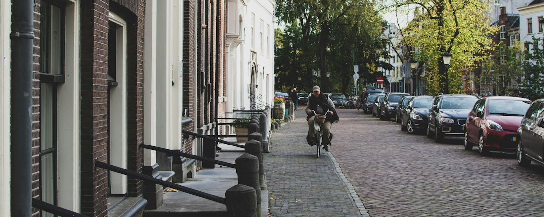 Cyclist and Parked Cars in Utrecht by Miriana Schiavone