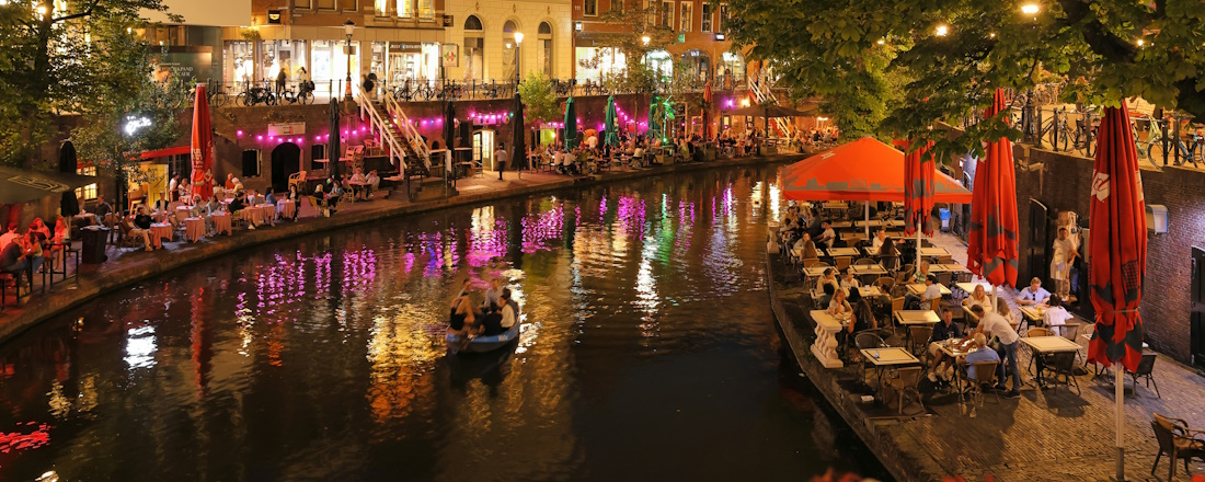 Dining by the Oudegraacht in Utrecht by Martin Woortman