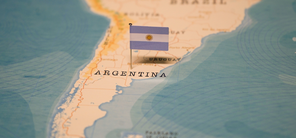 stylised map of Argentina with flag pin