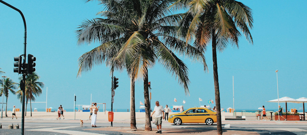 Pedestrians and Taxi in Copacabana, Rio de Janeiro, Brazil, by Nathana Rebouças on Unsplash