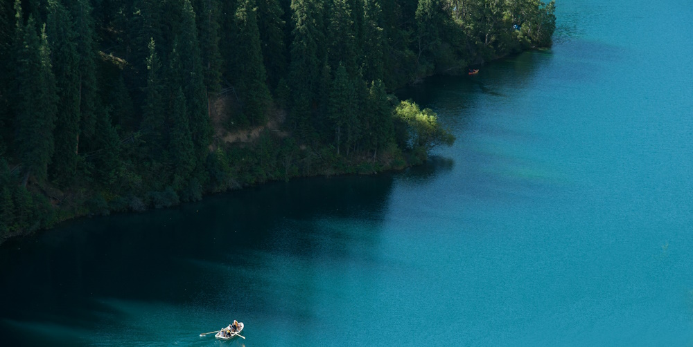 Boater in Kolsai Lake Kazakhstan by Evgeny Matveev