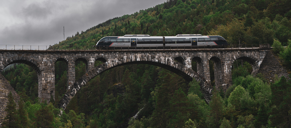 NORD Train on Kylling Bridge in Norway by Karl Paul Baldacchino on Unsplash