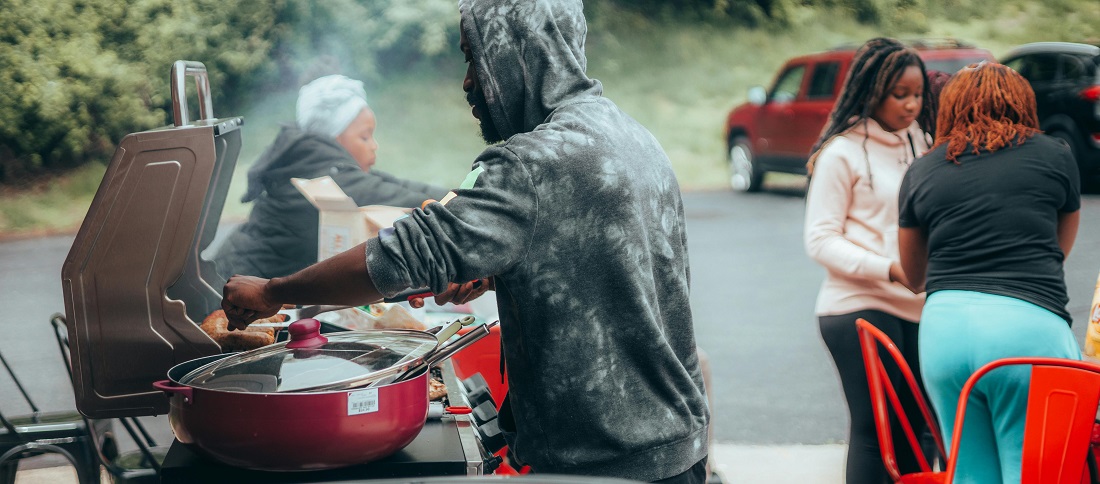 Man barbecuing meat by Samuel Peter