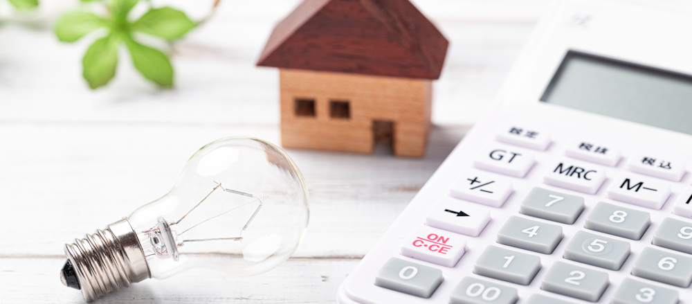 Utilities in Riyadh, represented by a calculator, lightbulb and wooden house