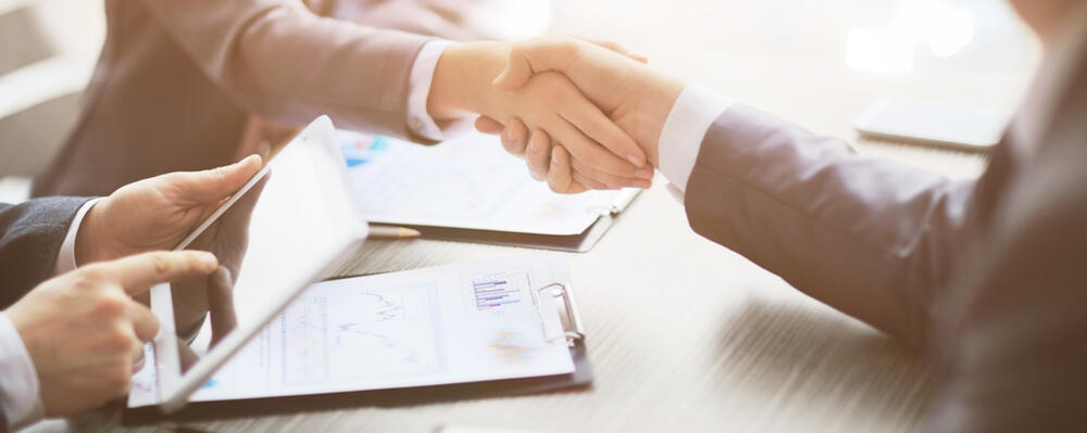 Business associates shaking hands