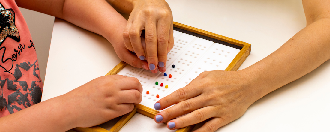student learning braille