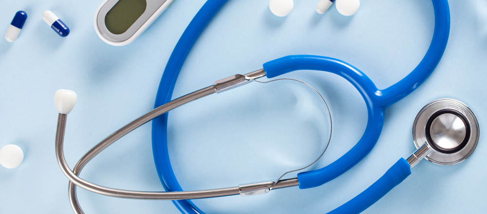 Flatlay with medical devices and pills