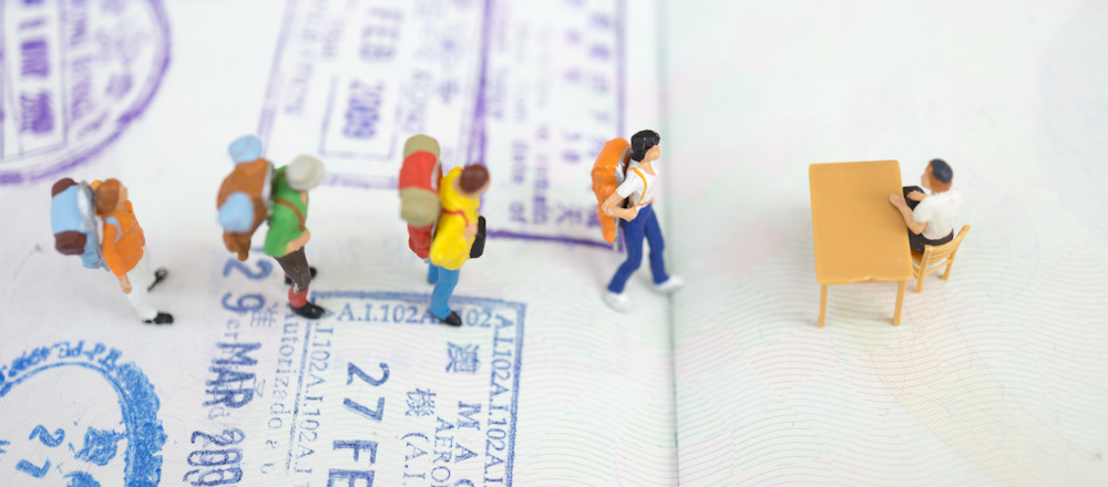 tourists queuing for customs check